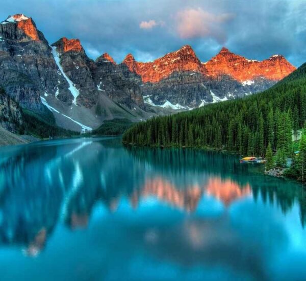 Turquoise Moraine Lake with sunrise-lit peaks in Banff National Park, Canada