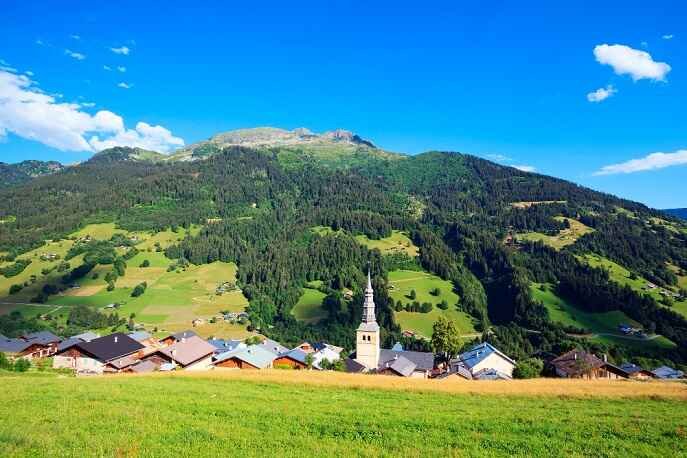 Idyllic village nestled in the green alpine Logar Valley, Slovenia.
