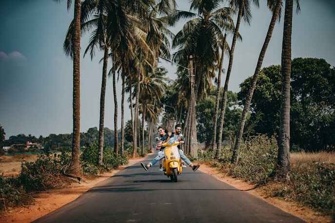 Couple riding a motorbike together – adventurous travel ideas and trending couple travel tips.