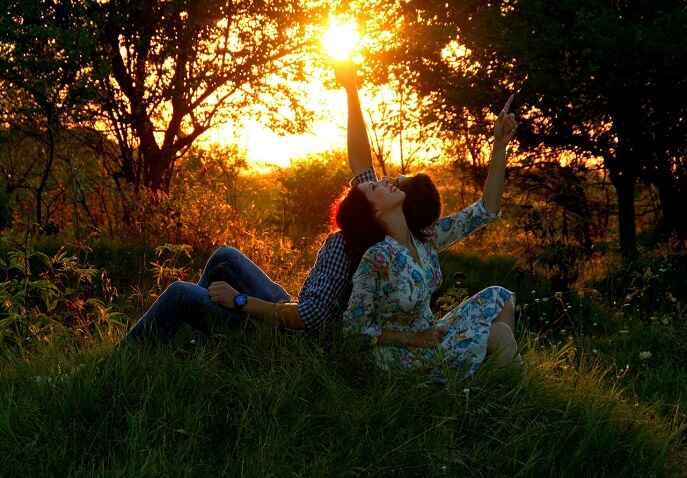 A happy couple in a quiet forest during golden hour, ideal for a peaceful Valentine’s getaway