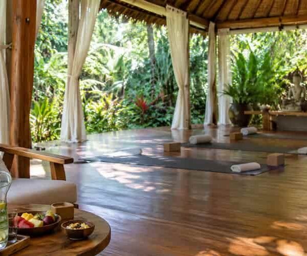 A peaceful wellness retreat setup surrounded by nature