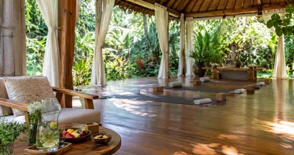 A peaceful wellness retreat setup surrounded by nature